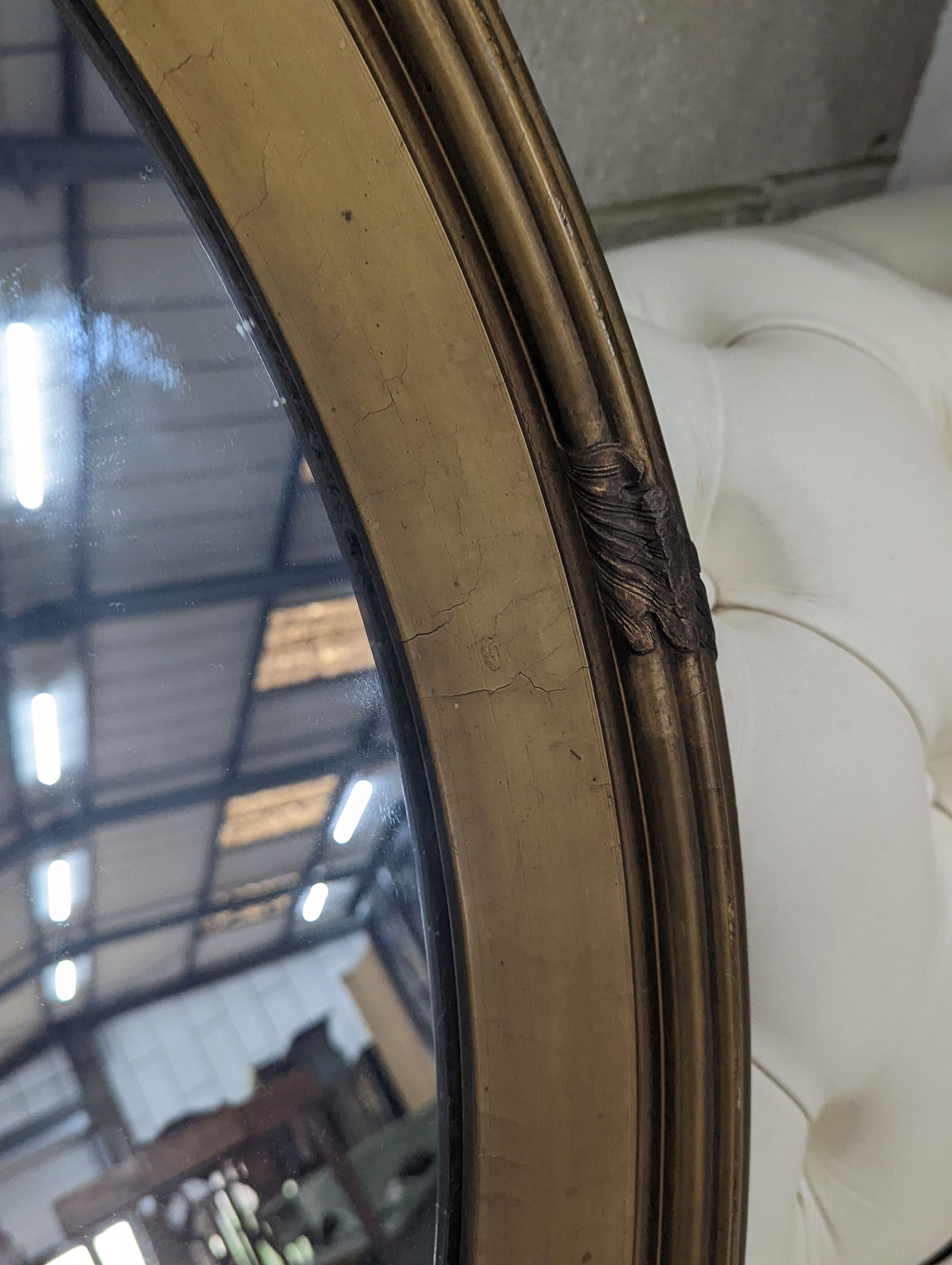 An Edwardian oval gilt framed wall mirror, width 72cm, height 87cm